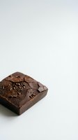 Rich dark chocolate brownie with cracked surface isolated on white background, ready for food photography, baking blogs, dessert menus, and culinary design projects.