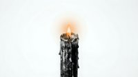 Black dripping candle with bright flame on white background isolated for design projects and decorative elements.