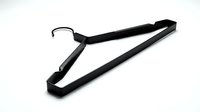 Black metal clothes hanger with matte finish isolated on white background, minimalist wardrobe accessory for clothing storage and retail display.