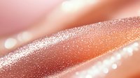 Shimmering rose gold diagonal abstract background with glitter sparkle effect and soft bokeh lights creating luxurious metallic texture for elegant designs.