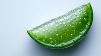 Fresh lime wedge with water droplets on bright surface, macro shot showing juicy citrus texture and natural moisture against white background.