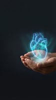 Glowing holographic human heart floating above cupped hands on dark background for medical technology and healthcare innovation concepts.