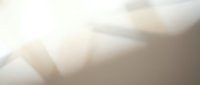 Soft beige and white abstract background with flowing organic shapes and gentle gradients for modern design projects and presentations.