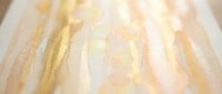 Soft golden light rays streaming through translucent surface creating warm ethereal glow with delicate texture for backgrounds and overlay effects.