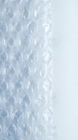 Bubble wrap plastic packaging material with air-filled pockets creating protective cushioning texture for shipping and storage applications.