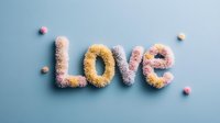 Fluffy textured word LOVE in pastel pink and yellow colors on light blue background with soft shadows and small decorative elements. Creative typography.