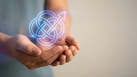 Hands holding glowing geometric infinity symbol with interconnected circles representing eternal connection, unity and endless possibilities in digital space.