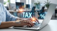 Professional accountant working on laptop with digital tax calculation interface and financial icons for business accounting services.