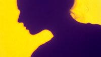 Silhouette of a woman in profile against bright yellow background, suitable for business, wellness, and portrait design projects.