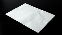 White crumpled paper sheet on black background for creative design projects and artistic compositions.