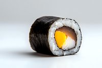 Fresh maki sushi roll with mango and cream cheese wrapped in nori seaweed and white rice, close-up view on light background. Japanese cuisine.