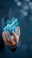 Businessman hand presenting holographic financial growth charts with upward arrows on blue bokeh background for business presentations and reports.