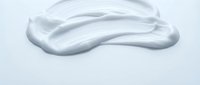 Smooth white gel or cream texture with flowing, organic wave patterns on light background for skincare and cosmetic product applications.