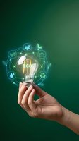 Hand holding glowing eco lightbulb with green energy icons and sustainable technology symbols on gradient background for environmental concepts.