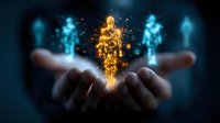 Glowing golden and blue holographic human figures floating above open palms against dark background, representing digital transformation and artificial intelligence.