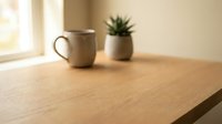 Cozy morning scene with ceramic mug and small potted plant on wooden table near bright window. Minimalist home decor setup for relaxation and mindfulness.