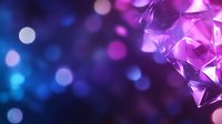 Abstract geometric crystal shapes in purple and blue with soft bokeh light effects creating magical atmospheric background for luxury designs.