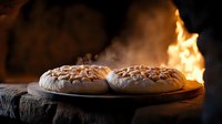 Freshly baked marshmallow-topped cookies on rustic wooden surface with dramatic fire flames in background creating cozy atmosphere for food photography.