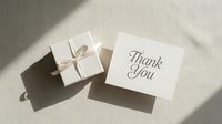Elegant thank you card beside a wrapped gift box with ribbon on a neutral linen background, soft shadows, minimalist style.