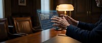 Professional developer coding on laptop in warm home office environment with ambient lighting creating productive workspace atmosphere for remote work.