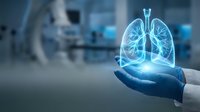 Medical professional holding glowing blue holographic lungs in modern hospital setting for healthcare technology and respiratory medicine concepts.
