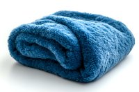 Soft blue plush blanket folded and rolled on white background, cozy textile for home comfort and warmth during cold seasons.