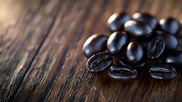 Fresh dark roasted coffee beans scattered on rustic wooden surface with dramatic lighting and shallow depth of field creating moody atmosphere for food photography.