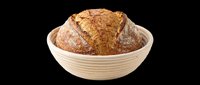 Artisan sourdough bread loaf in cream proofing basket, isolated on transparent background. Ready for bakery designs, food packaging, menus, print-on-demand products, and culinary graphics.