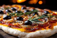 Fresh homemade pizza with black olives, rosemary herbs and tomato sauce on wooden board, macro food photography in warm lighting with selective focus.
