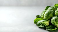 Fresh Brussels sprouts on light background with copy space for healthy cooking and nutrition concepts.