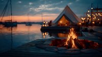 Cozy camping scene with glowing tent and crackling campfire by serene lake at sunset. Sailboats anchored in calm water create peaceful outdoor adventure atmosphere.