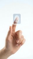 Hand touching digital fingerprint scanner interface for biometric security authentication and identity verification on white background.