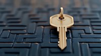 Golden house key resting on dark textured maze pattern background, symbolizing security solutions and property access.