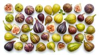 Fresh figs in various stages of ripeness arranged on white background, showing green, yellow, and deep purple varieties with some cut open to reveal pink flesh. Suitable for food photography, culinary design, healthy eating content, and agricultural marketing materials.