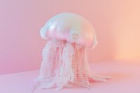 Translucent jellyfish sculpture with delicate tentacles on pink gradient background creates dreamy underwater atmosphere, suitable for marine decor and artistic displays.