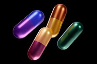 Colorful pharmaceutical capsules in metallic blue, copper, and green tones floating on black background, medical concept for healthcare and medicine industry.