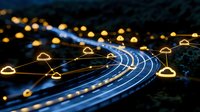 Futuristic highway with glowing light trails and connected network nodes illuminating the night landscape, representing smart transportation technology.