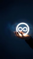 Hand holding glowing infinity symbol neon sign against dark blue background, representing endless possibilities, sustainable growth, and circular economy concepts for business and technology.