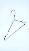 Shiny chrome metal clothes hanger isolated on white background, minimalist wardrobe accessory for fashion, retail, and laundry concepts.