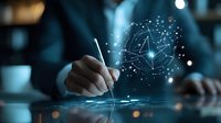 Futuristic digital brain hologram floating over businessperson writing, illustrating artificial intelligence and machine learning concept in blue tech environment.