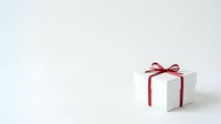 White gift box with red ribbon bow on neutral background, suitable for holiday, celebration, and retail marketing materials.