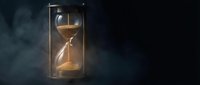 Hourglass with flowing golden sand against dark moody background, symbolizing passage of time, deadline urgency, and temporal concepts for business and design projects.