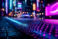 Vibrant neon city lights reflect on wet surface creating colorful bokeh effect with pink and blue hues in urban night scene, macro photography perspective.