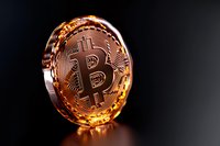 Golden bitcoin cryptocurrency coin with reflective surface and dark background, showing detailed circuit pattern and iconic crypto symbol for finance concepts.