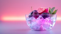 Fresh cherries and ice cubes in glass bowl on pink gradient background with neon lighting effect creating modern minimalist composition for beverage and food styling.