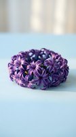 Purple hyacinth flower crown arrangement on soft blue surface with natural lighting for spring wedding decor and floral design projects.