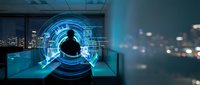 Businessman silhouette with futuristic holographic interface in modern office overlooking city skyline at night for technology and innovation concepts.