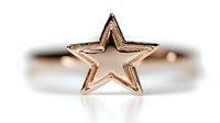Delicate rose gold star ring on white background, minimalist jewelry design with open star shape, isolated macro shot for fashion and accessory marketing.