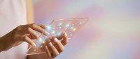 Hands holding transparent smartphone with glowing digital network connections and light effects on soft gradient background for technology concepts.