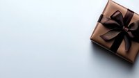 Elegant copper-colored gift box with black satin ribbon bow on minimal white background with copy space for holiday and celebration designs.